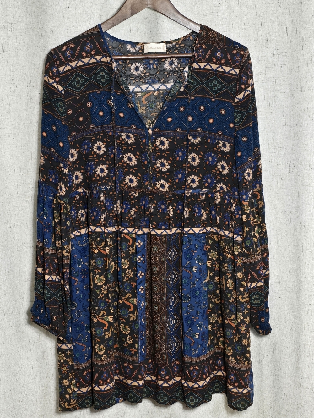 Altar'd State peasant-style dress With a bohemian pattern.